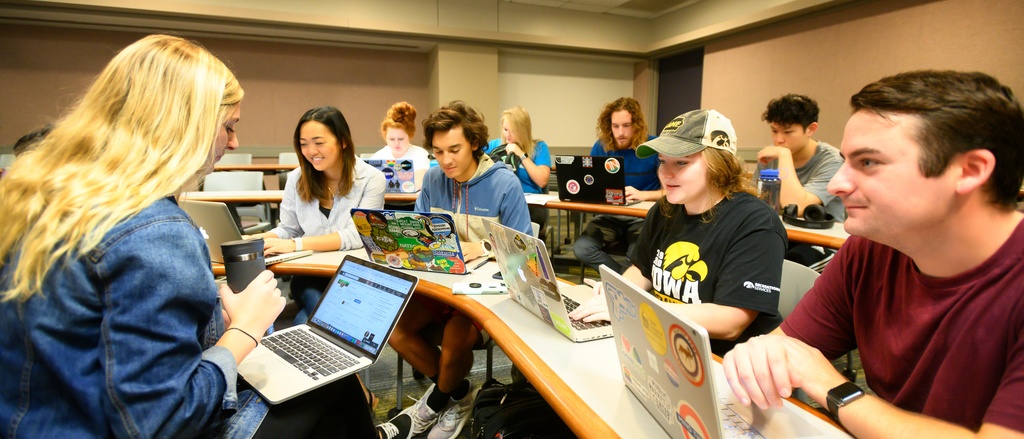 Students and instructor sitting in a circle