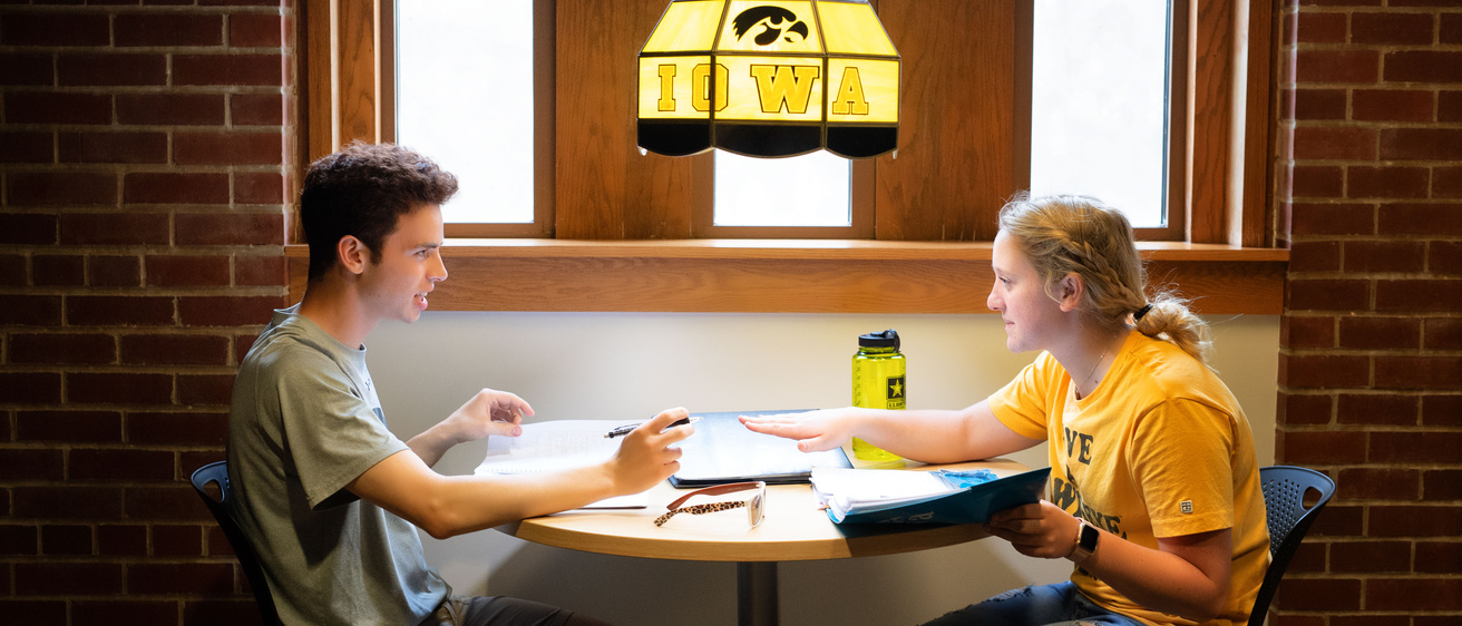 Two students sitting at a table in the IMU